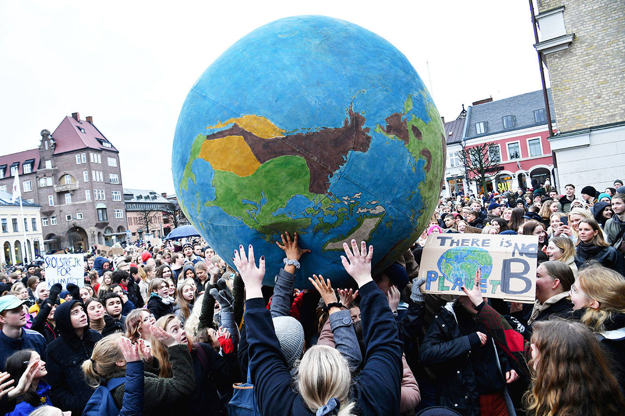 Students participate in a climate protest, at Stortorget in Lund, Sweden, on Friday. Students worldwide skipped classes Friday to take to the streets to protest their governments’ failure to take sufficient action against global warming. (Johan Nilsson /TT News Agency via AP)