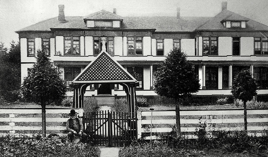 In 1893, Snohomish County built its poor farm at Allen Prairie west of Monroe. Shown in this 1909 photo, it later became the site of Valley General Hospital, now EvergreenHealth Monroe hospital. (Courtesy Monroe Historical Society)
