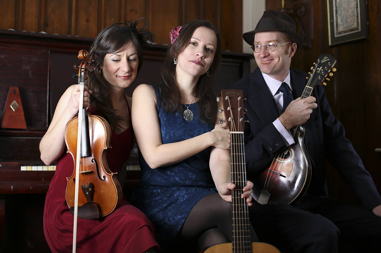 Low Lily, made up of (from left) Lissa Schneckenburger, Liz Simmons and Flynn Cohen will perform March 24 at the Thumbnail Theater in Snohomish. (Andy Cambria)