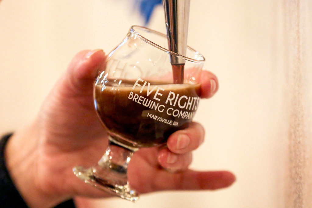 A sample brew is drawn during the soft opening of 5 Rights Brewing. (Kevin Clark / The Herald)
