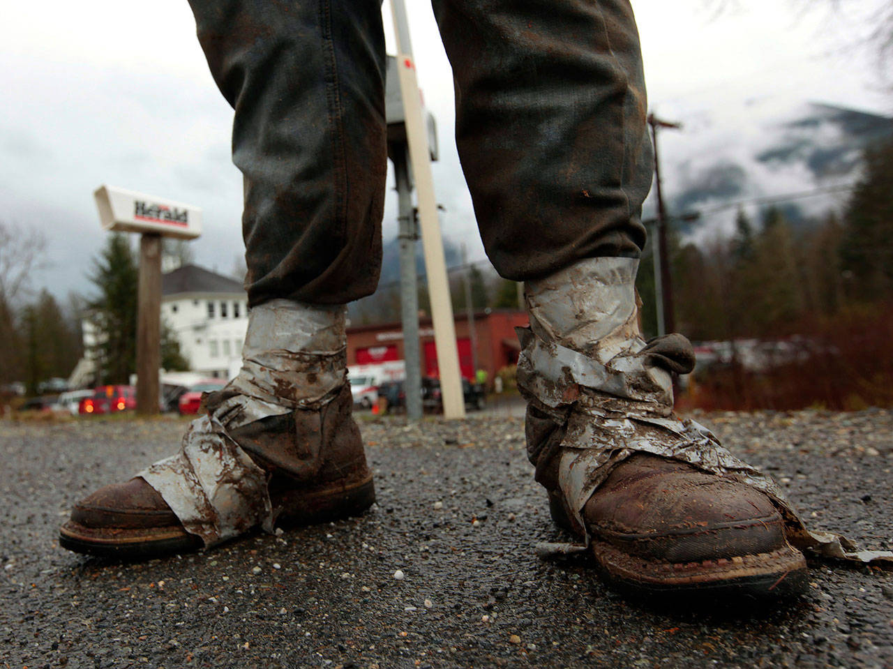 Sonny Blankenship, 18, a senior at Westin High School in Arlington, walks home from the Oso Fire Department after spending the day volunteering in the slide area on March 25, 2014. Blankenship, who lives across the street from the Oso Fire Department, took the day off from school to sort through debris in the slide area just miles from his home. (Mark Mulligan / The Herald)