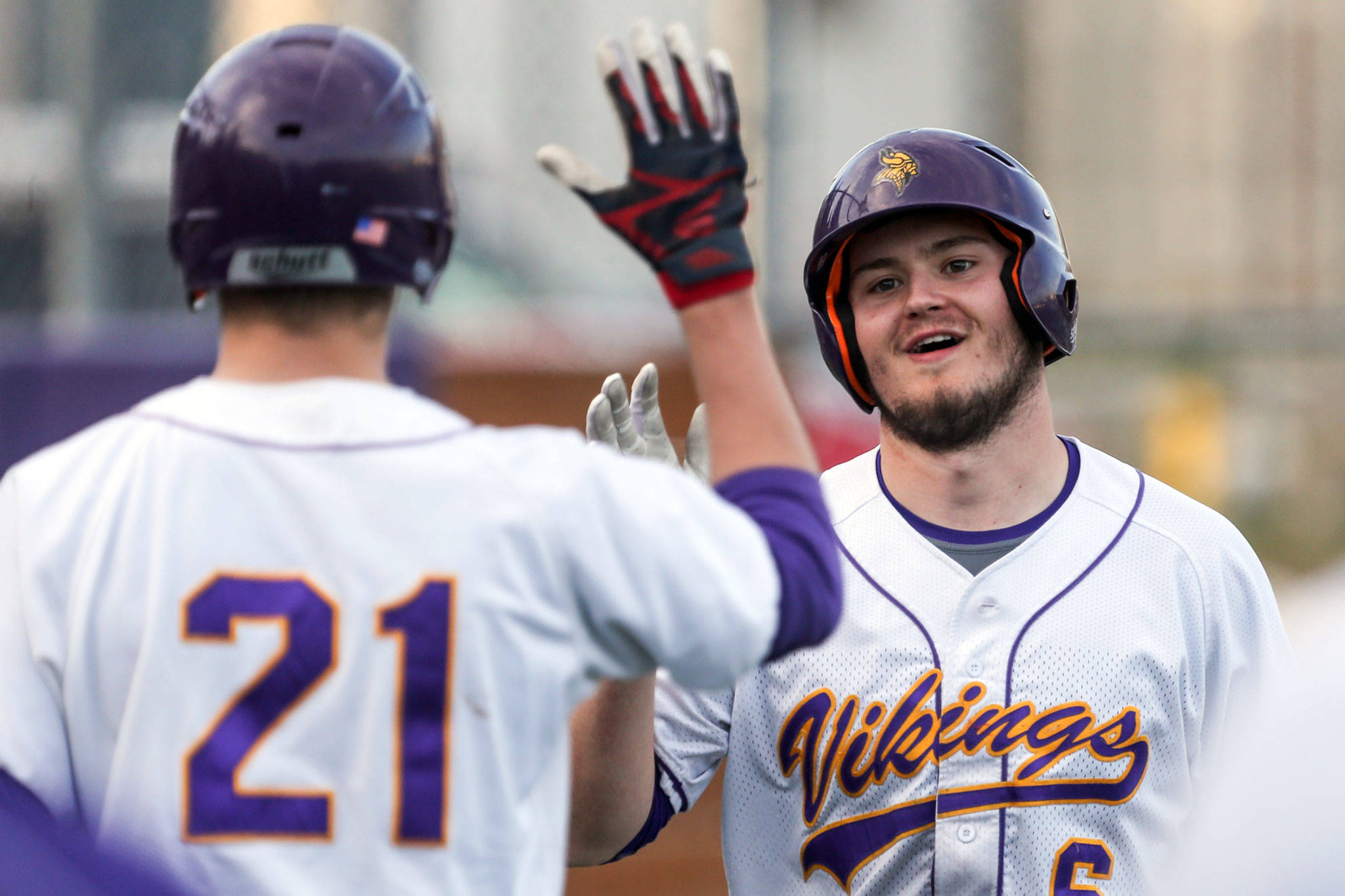Lake Stevens’ Theron Perkins (right) celebrates with teammate Cameron Austin during the Vikings’ 17-9 win over Meadowdale on Thursday in Lake Stevens. Perkins went 3-for-4 with five RBI in the victory. (Kevin Clark / The Herald)