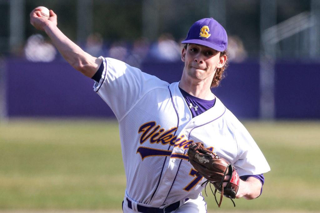 Lake Stevens’ Xander Fogel throws against Meadowdale during a non-conference baseball game Thursday in Lake Stevens. Fogel and the Vikings beat the Mavericks 17-9. (Kevin Clark / The Herald)
