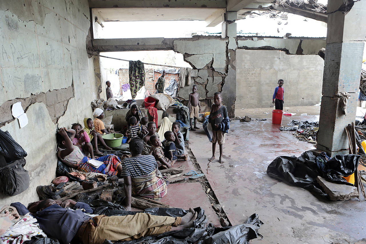 Survivors of Cyclone Idai in an abandoned and derelict building near Nhamatanda about 50 kilometres from Beira, in Mozambique on Friday. (AP Photo/Tsvangirayi Mukwazhi)