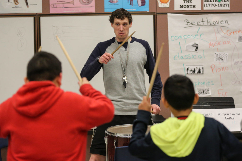 Pat Jameson leads the drum circle during practice at Challenger Elementary in Everett on March 6, 2019. (Kevin Clark / The Herald)
