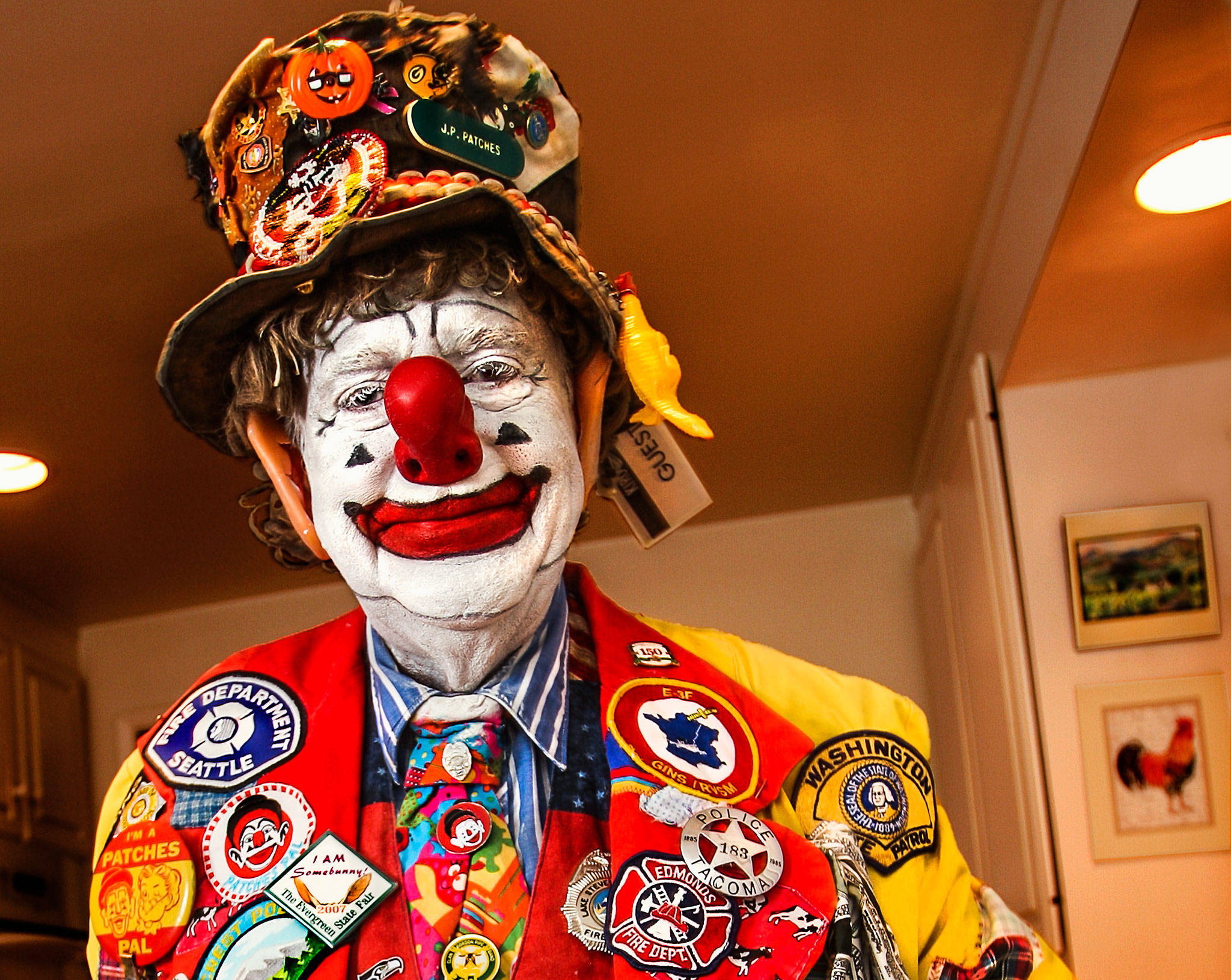 At his home in Edmonds in 2008, Chris Wedes, 80, had transformed himself into the popular clown Julius Pierpont “J.P.” Patches. Wedes was battling cancer, which took his life four years later on July 22, 2012. (Dan Bates / The Herald)