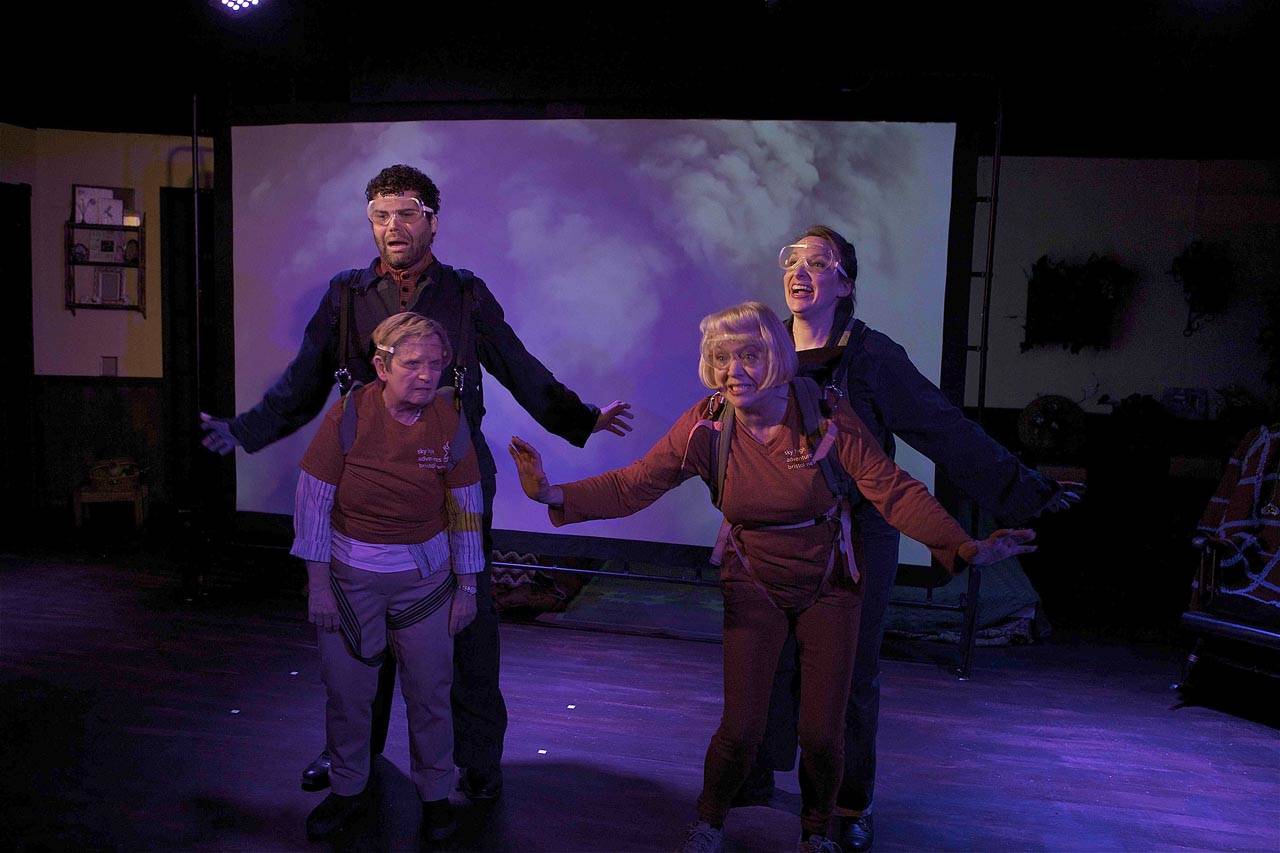 Phoenix Theatre uses video projections in a scene from “Ripchord” where its main characters skydive. Pictured are Melanie Calderwood and Greg Klaciak at left and Susan Connors and Renee Gilbert at right. (Jim Sipes)