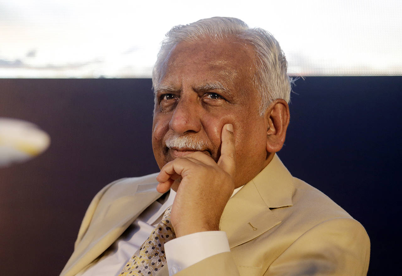 In this 2017 photo, Jet Airways Chairman Naresh Goyal sits during a press conference to announce the signing of enhanced cooperation agreement with Air France-KLM in Mumbai, India. The chairman of India’s private Jet Airways has quit amid mounting financial woes forcing the airline to suspend operations on 14 international routes with more than 80 planes grounded. (AP Photo/Rajanish Kakade, file)