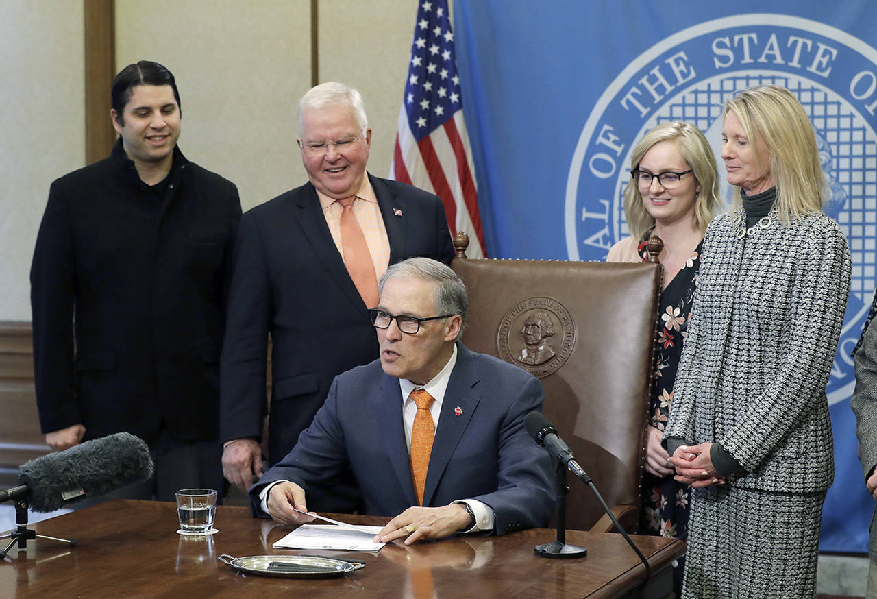 Washington Gov. Jay Inslee speaks before signing a bill funding gun bump stock buybacks on March 14 in Olympia. (AP Photo/Ted S. Warren, file)