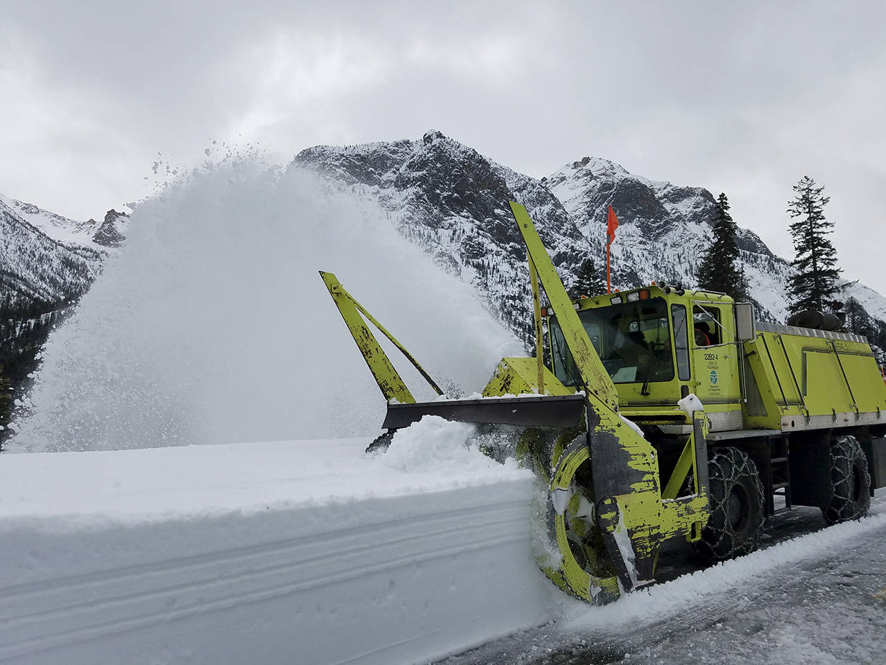 A blower moves snow off the North Cascades Highway during the first week of clearing in 2018. (Washington State Department of Transportation)