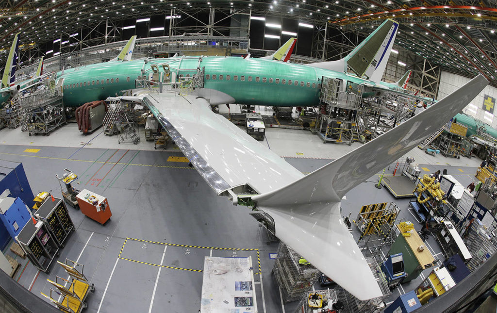 In this photo taken with a fish-eye lens, a Boeing 737 MAX 8 airplane sits on the assembly line during a brief media tour in Boeing’s 737 assembly facility on March 27 in Renton. (AP Photo/Ted S. Warren)
