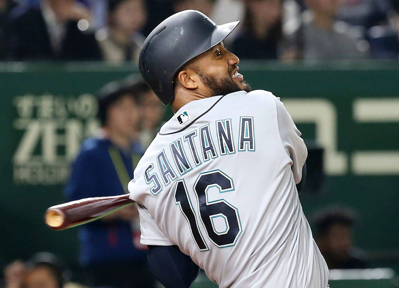 The Mariners’ Domingo Santana hits a grand slam in the third inning of a game against the Athletics on March 20, 2019, in Tokyo. (AP Photo/Koji Sasahara)