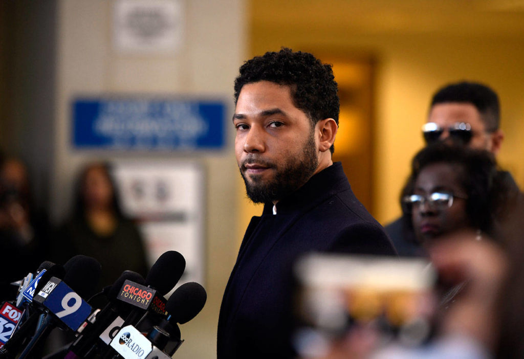 Actor Jussie Smollett talks to the media Tuesday before leaving Cook County Court in Chicago after his charges were dropped. (AP Photo/Paul Beaty)
