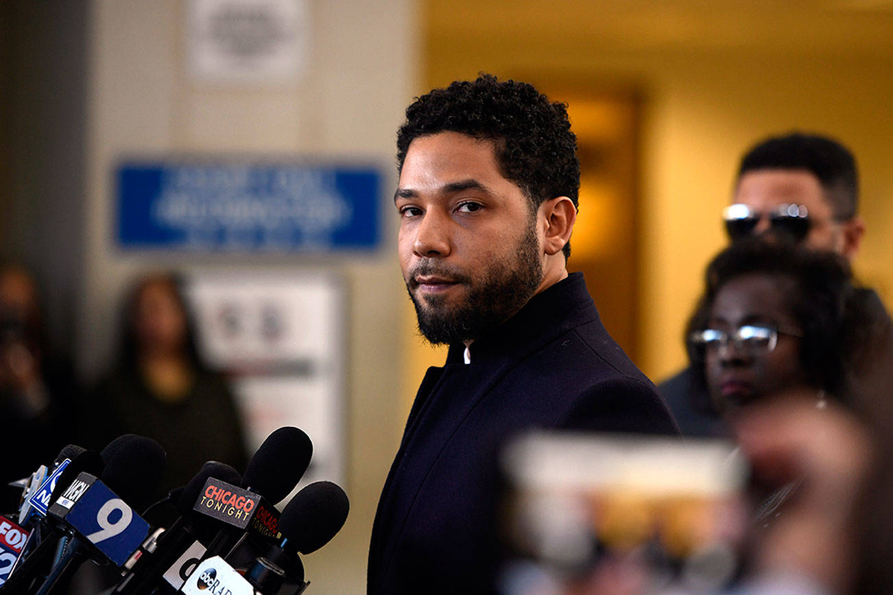 Actor Jussie Smollett talks to the media Tuesday before leaving Cook County Court in Chicago after his charges were dropped. (AP Photo/Paul Beaty)