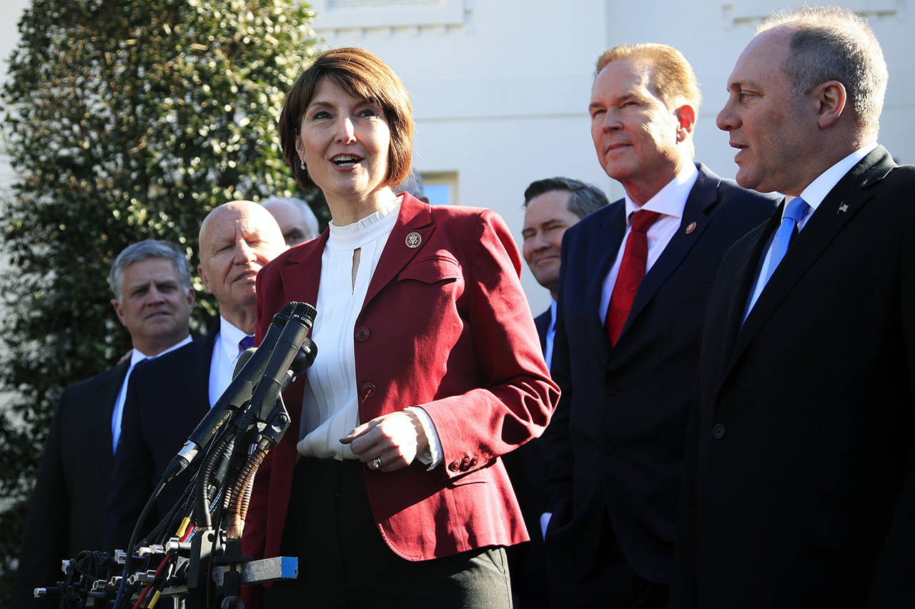 Rep. Cathy McMorris Rodgers, R-Wa., together with Rep. Kevin Brady, R-Texas (left), Rep. Steve Scalise, R-La. (right), Rep. Vern Buchanan, R-Fla. (second from right), and other Republican members of Congress speaks to reporters outside the West Wing of the White House following a meeting with President Donald Trump at the White House in Washington on Tuesday. (AP Photo/Manuel Balce Ceneta)