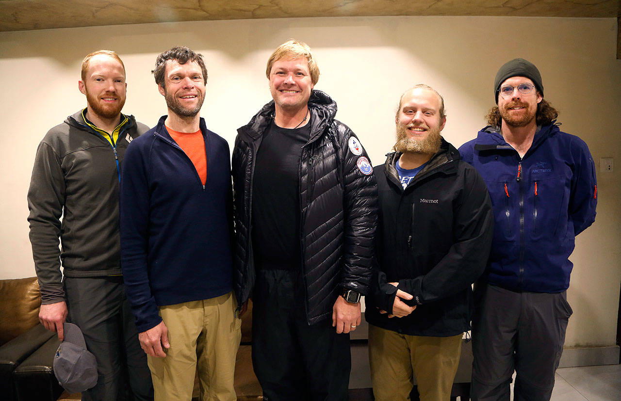 Western Washington University Professor John All (center) and his team pose for a photograph at a hotel before leaving Wednesday for the Everest region in Kathmandu, Nepal. (AP Photo/Niranjan Shrestha)