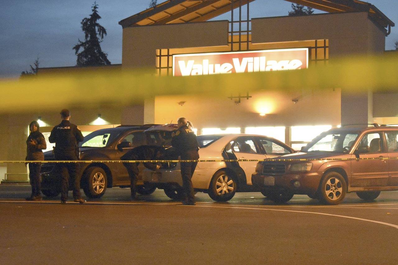 A man was shot three times in December 2017, outside a Value Village in Everett. A suspect was charged this month. He’s at large. (Caleb Hutton / Herald file)
