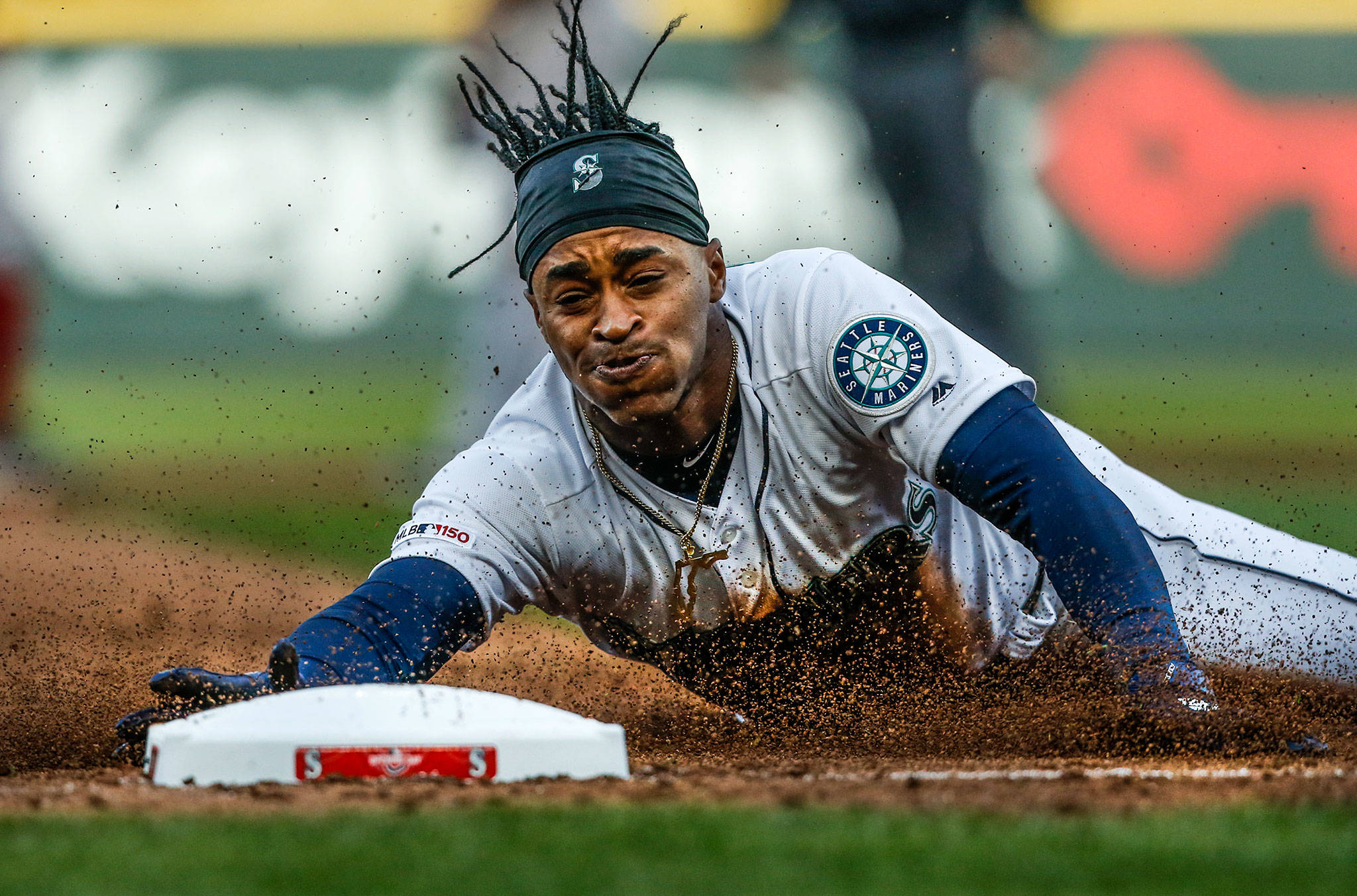 The Mariners’ Mallex Smith slides into third base during a game against the Red Sox on March 28, 2019, at T-Mobile Park in Seattle. (Olivia Vanni / The Herald)