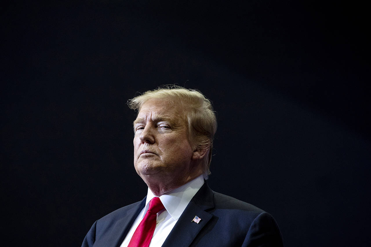 President Donald Trump holds a campaign rally at Van Andel Arena in Grand Rapids, Michigan on Thursday. (Cory Morse/MLive.com/The Grand Rapids Press via AP)