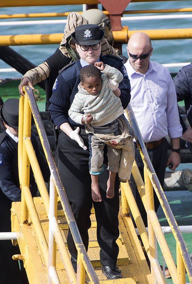 Migrants are disembarked from Turkish oil tanker El Hiblu 1, which was hijacked by migrants, in Valletta, Malta, on Thursday. (AP Photo/Rene’ Rossignaud)