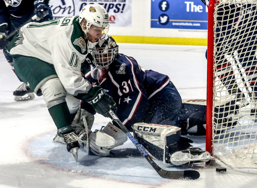 Everett’s Lucas Cullen attempts a goal with Tri-City’s Talyn Boyko defending in the second period during game 5 of the playoffs Saturday night at Angel of the Winds Arena in Everett on March 30, 2019. (Kevin Clark / The Herald)
