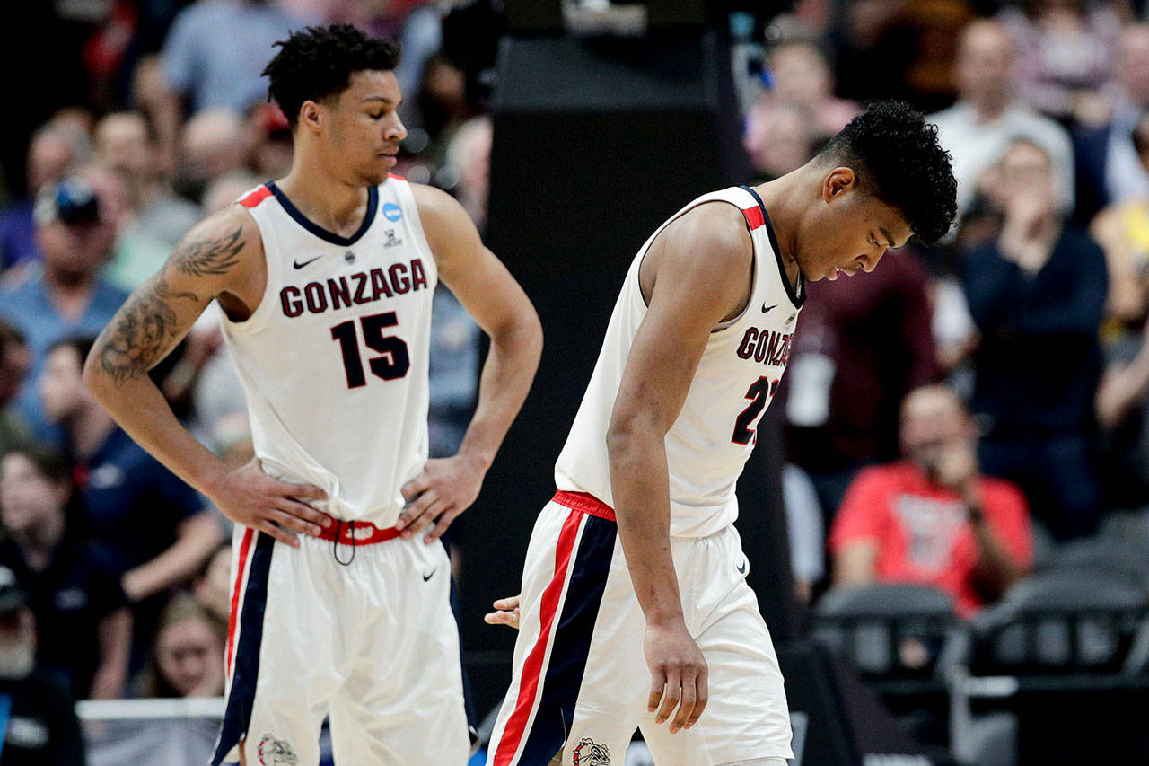 Gonzaga forward Rui Hachimura (right) and Brandon Clarke react after the team’s loss to Texas Tech 75-69 in the NCAA tournament West Region final on March 30, 2019, in Anaheim, Calif. (AP Photo/Jae C. Hong)