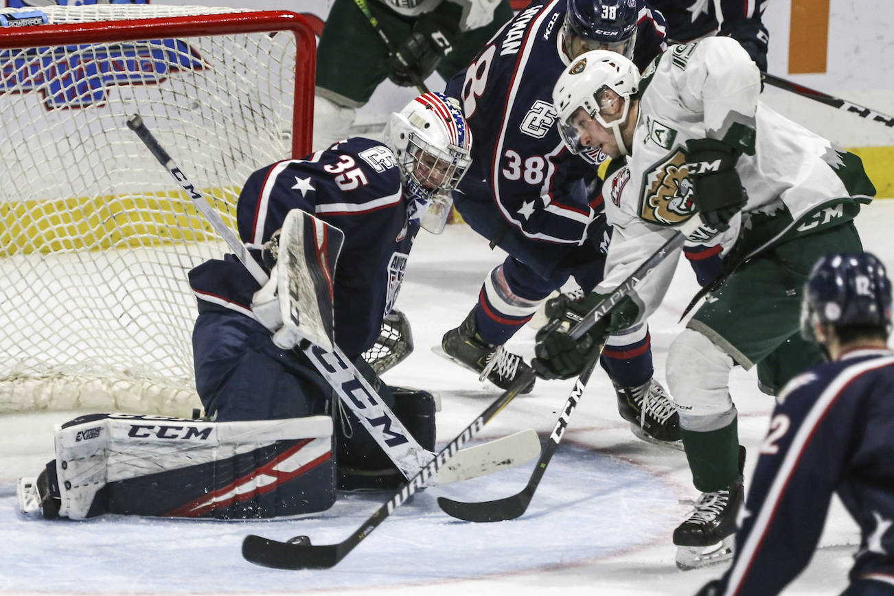 Everett’s Bryce Kindopp scores a goal past Tri-City’s Beck Warm in the first period during game 5 of the playoffs Saturday night at Angel of the Winds Arena in Everett on March 30, 2019. (Kevin Clark / The Herald)