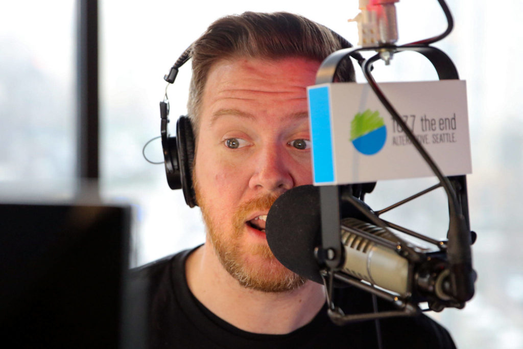 Gregr is on the air for 107.7 The End every weekday, from 6 to 10 a.m. It means an early wakeup and commute for him from his Snohomish home. (Kevin Clark / The Herald)
