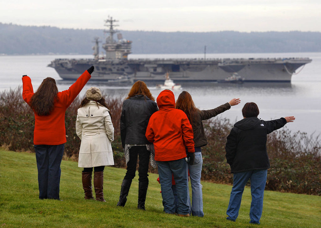 The aircraft carrier USS Nimitz returns to Naval Station Everett on Dec. 16, 2013. (Dan Bates / Herald file)

