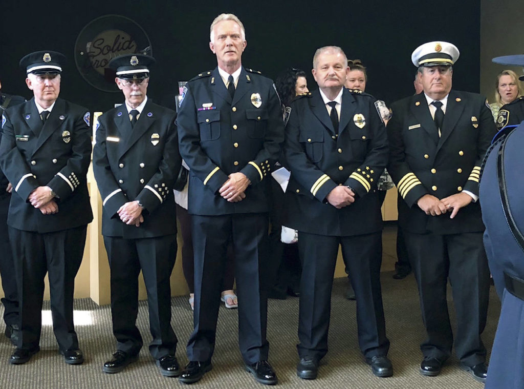 Mountlake Terrace Cmdr. Doug Hansen (center) and Chief Pete Caw (center right). (Mountlake Terrace Police Department)
