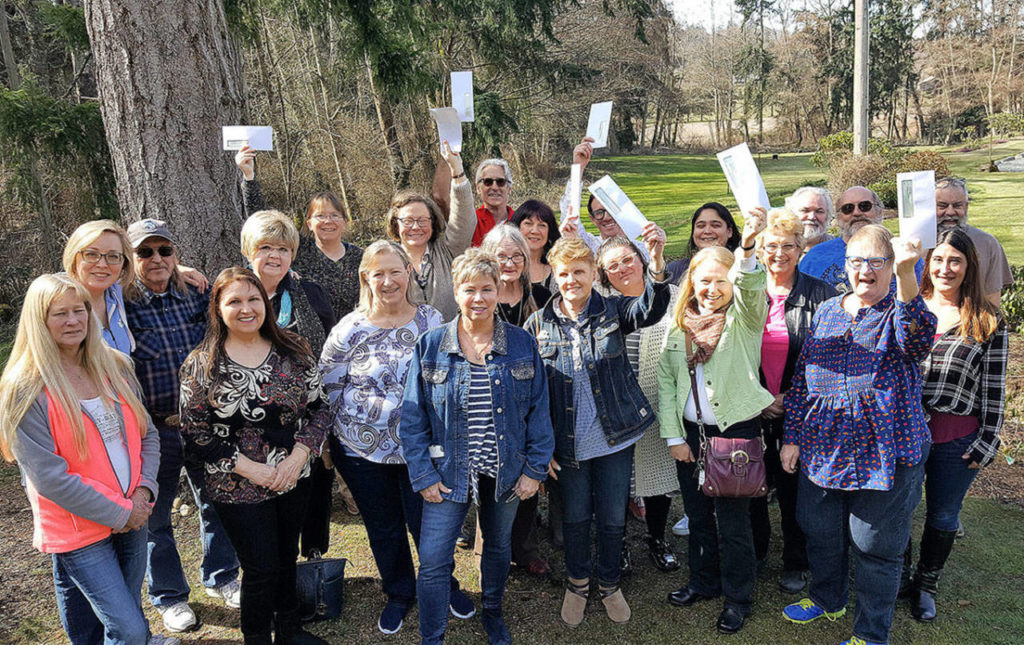 HH Photo 
The Whidbey Island Eagles Aerie Board of Directors gathers with representatives of 12 island nonprofits after presenting the organizations with $15,000.
