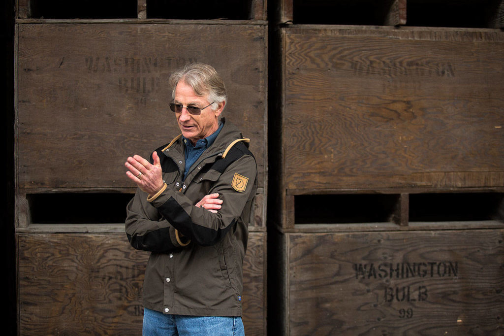 Leo Roozen, president of Washington Bulb Company, talks to visitors. (Andy Bronson / The Herald)
