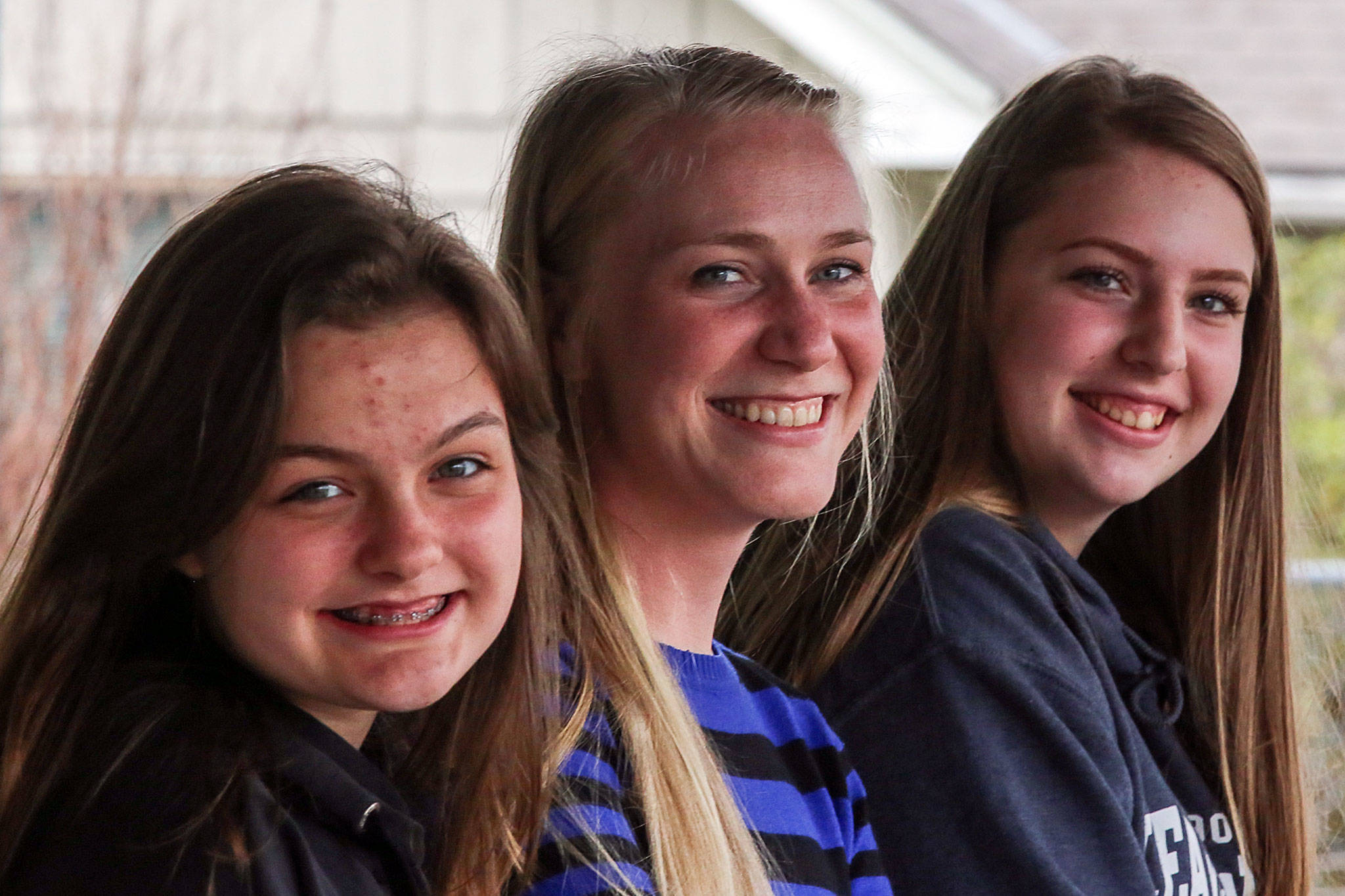 Lynsey Gagnon, (center) Director of the Service center, with two Sultan High Schools students Kristin Larson (left) and Cheryn Hagen (right) will speak at next month’s upcoming Youth and Family Wellness fair. (Kevin Clark / The Herald)