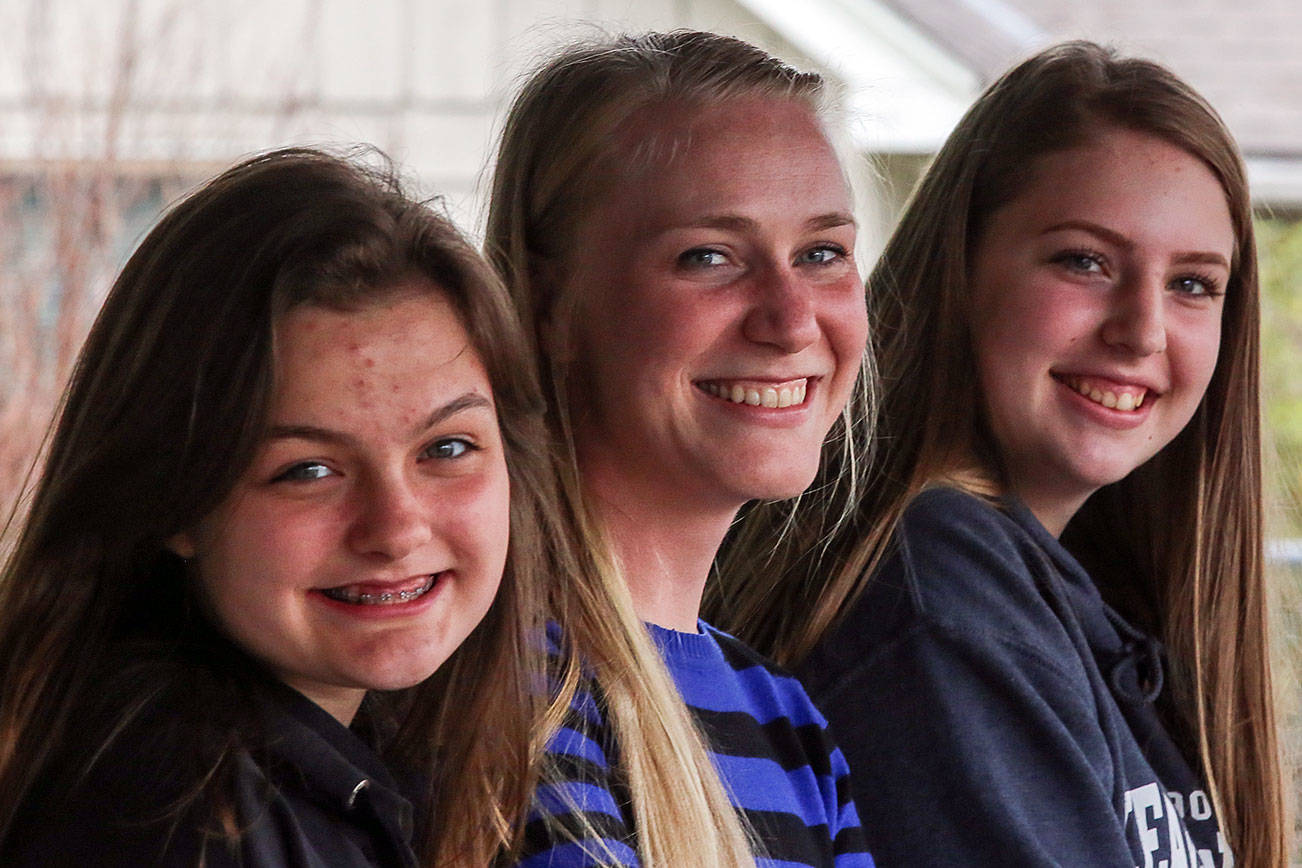 Lynsey Gagnon, (center) Director of the Service center, with two Sultan High Schools students Kristin Larson (left) and Cheryn Hagen (right) will speak at next month’s upcoming Youth and family wellness fair. (Kevin Clark / The Herald)