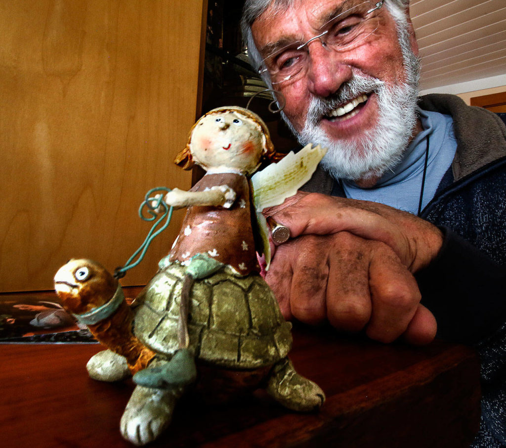This whimsical art of an angel riding a turtle represents how Kerr now tries to live, simply and slowly. (Dan Bates / The Herald)
