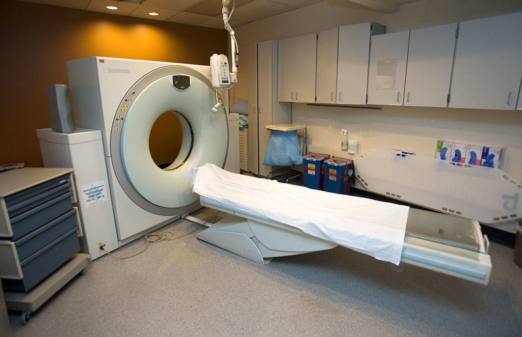 EvergreenHealth Monroe’s CT machine is also nearing the end of its life. It’s currently down the hall from the ER, but a new machine would be be installed in the ER. A new machine would also reduce scan time from 25 minutes to about eight. (Andy Bronson / The Herald)
