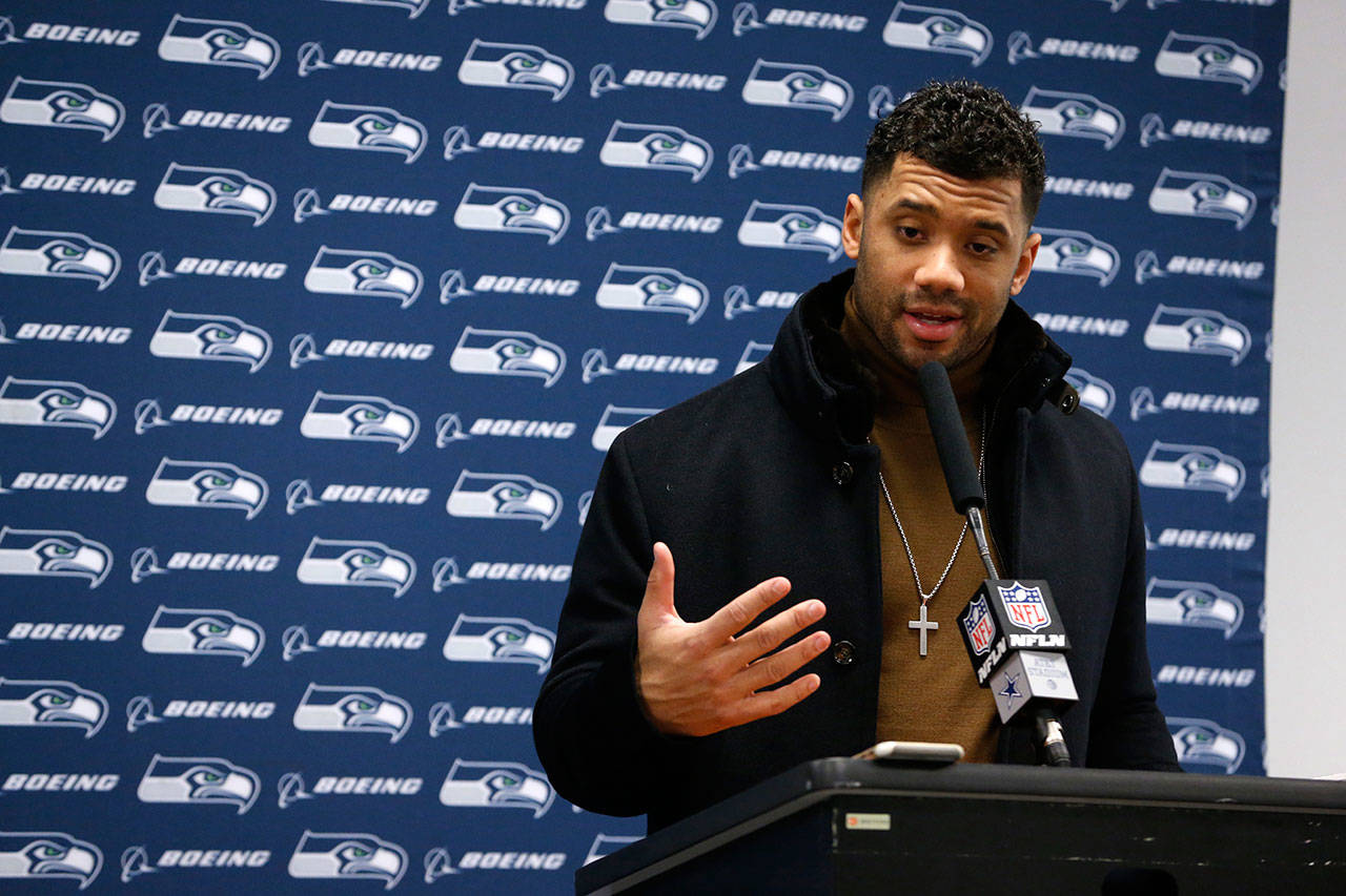 Seattle Seahawks quarterback Russell Wilson responds to questions during a news conference after the Seahawks’ 24-22 loss to the Dallas Cowboys in an NFC playoff game on Jan. 5, 2019. (AP Photo/Michael Ainsworth)