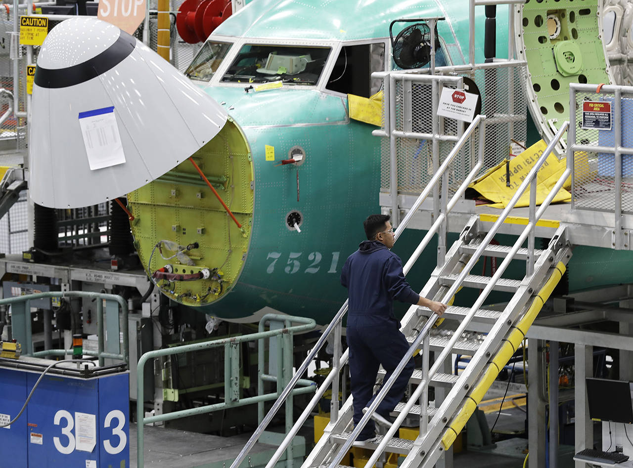 A Boeing 737 MAX 8 airplane is shown on the assembly line during a brief media tour of Boeing’s 737 assembly facility on March 27 in Renton. (AP Photo/Ted S. Warren, file)