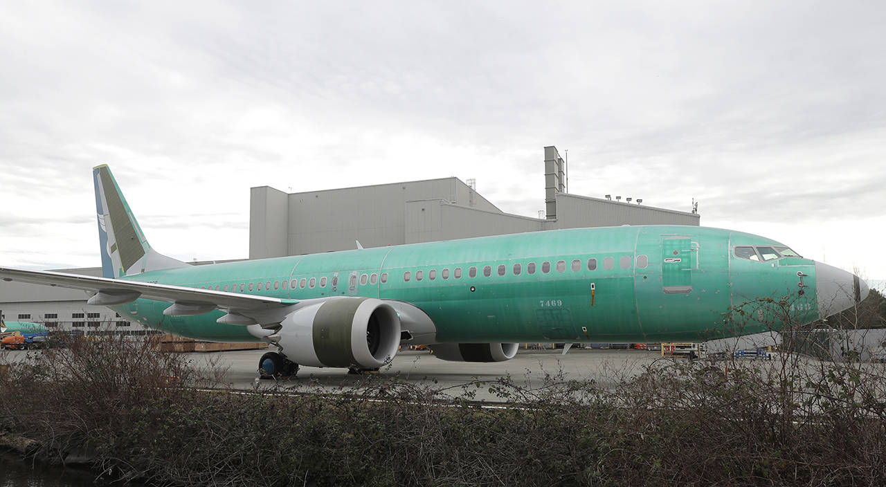 In this March 11 photo, a Boeing 737 MAX 8 being built for Oman Air sits parked at Boeing Co.’s Renton Assembly Plant in Renton. (AP Photo/Ted S. Warren, File)