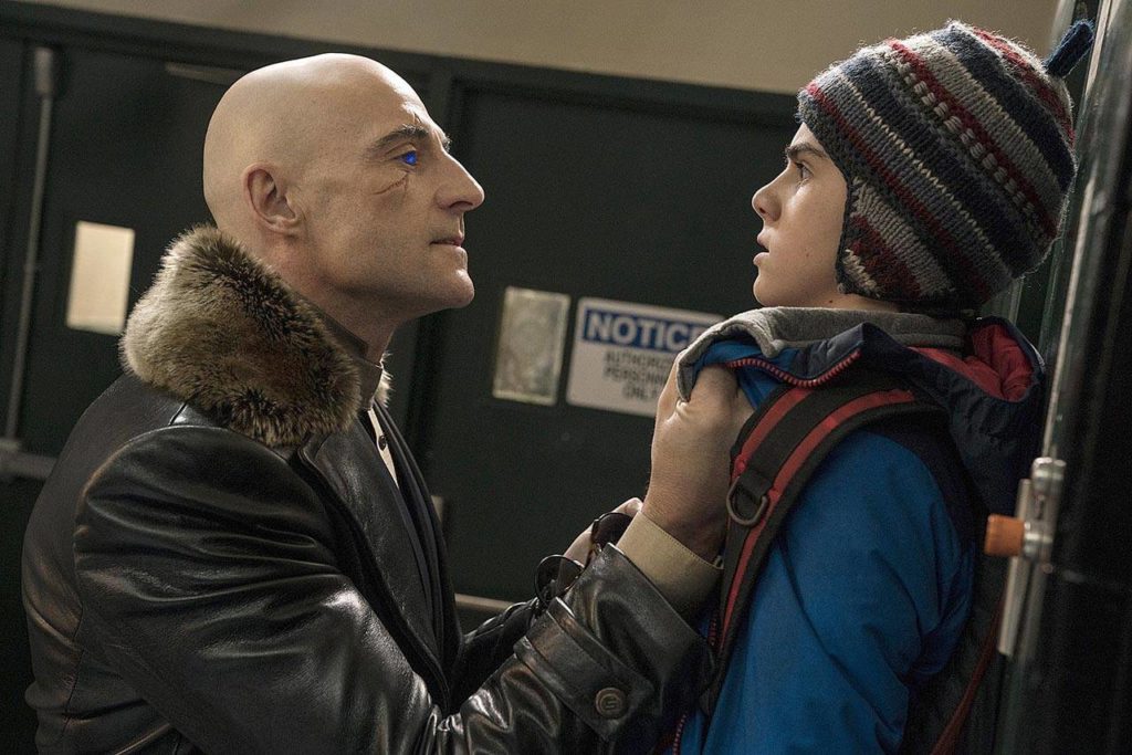 Mark Strong (left) plays the evil Dr. Sivana, here menacing Freddy (Jack Dylan Grazer), in “Shazam!” (Warner Bros. Pictures)
