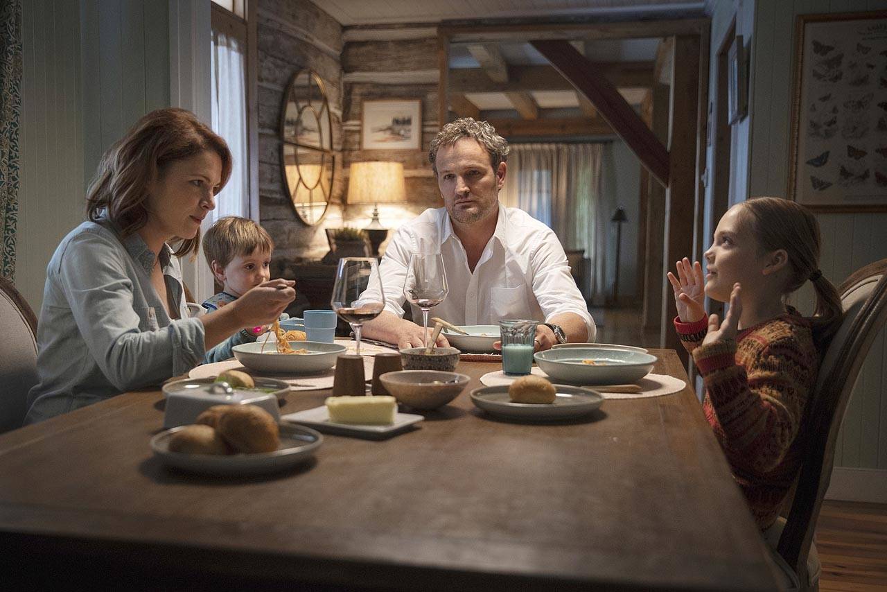 From left, Amy Seimetz, Hugo Lavoie, Jason Clarke and Jeté Laurence share a tense family meal in “Pet Sematary.” (Paramount Pictures)