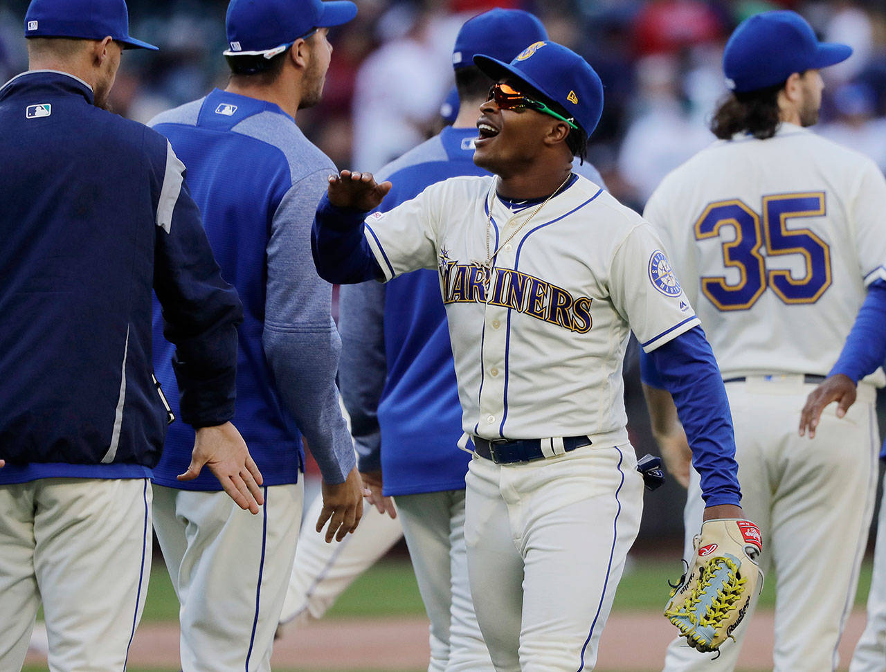 The Mariners’ Mallex Smith celebrates with teammates after a 10-8 win over the Red Sox on March 31, 2019, in Seattle. (AP Photo/Ted S. Warren)