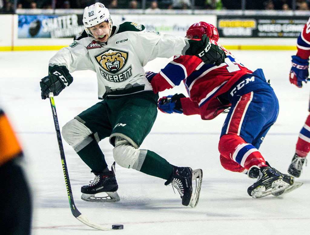 The Silvertips’ Gage Gonclaves escapes a hit during the a playoff game against the Chiefs on April 6, 2019, in Everett. (Olivia Vanni / The Herald)
