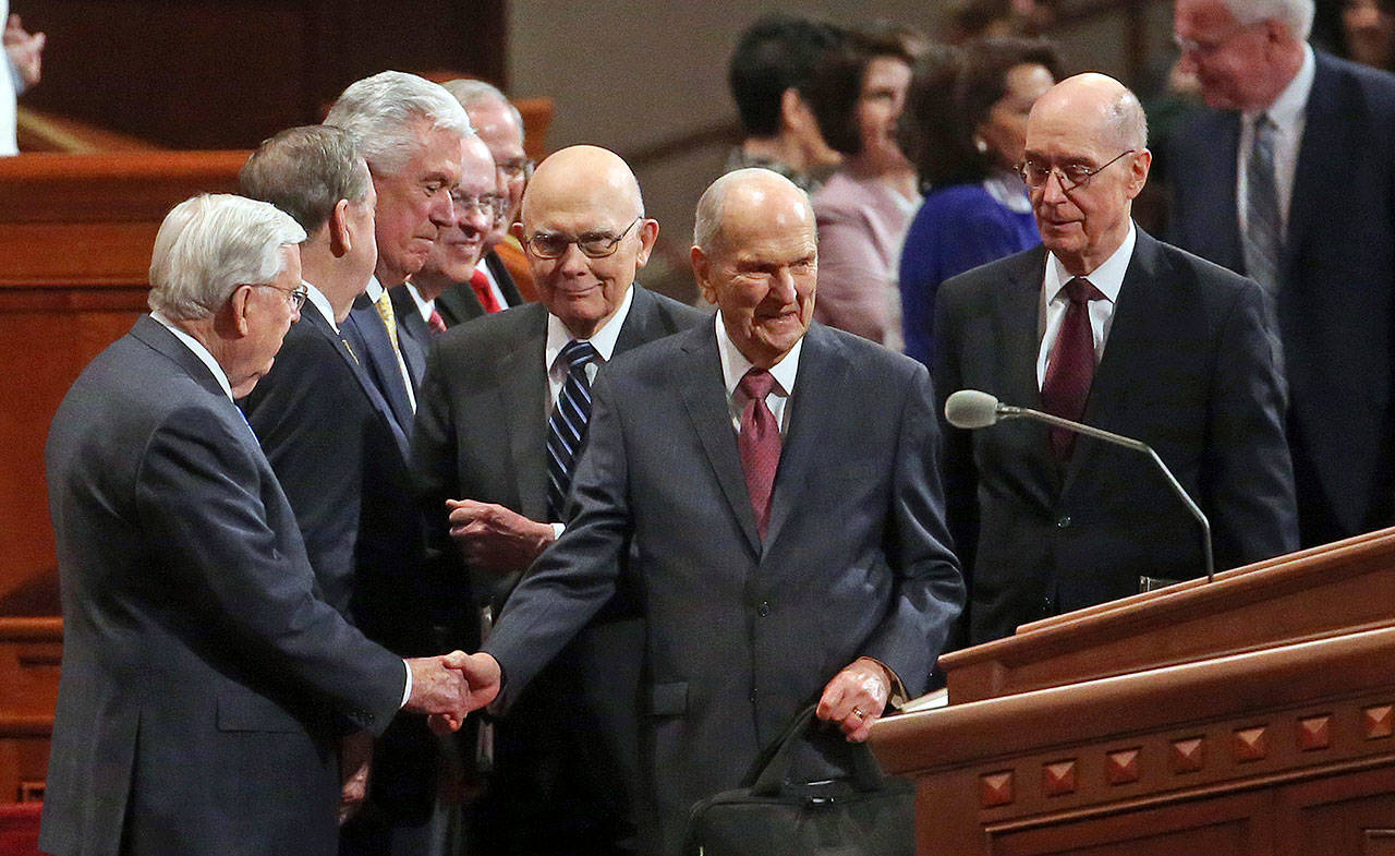 The Church of Jesus Christ of Latter-day Saints President Russell M. Nelson (center) greets the church’s conference Saturday in Salt Lake City. Church members are preparing for more changes as they gather in Utah for a twice-yearly conference to hear from the faith’s top leaders. (AP Photo/Rick Bowmer)