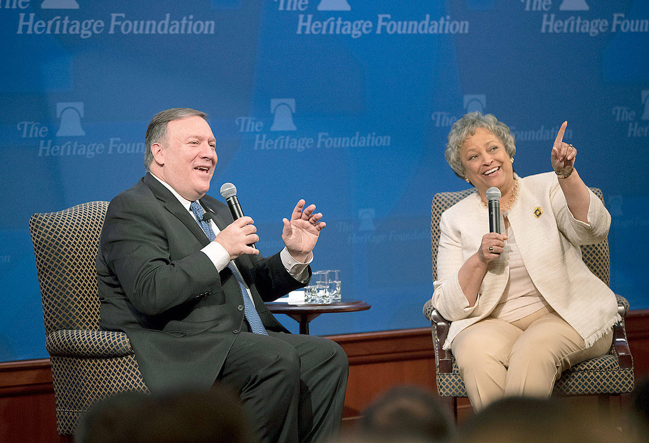 Secretary of State Mike Pompeo, left, joined by Heritage Foundation President Kay Coles James, on May 21, 2018 speaks at the Heritage Foundation, a conservative public policy think tank, in Washington. Google employees have had more success than other tech workers at demanding change at the company. Google dropped a contract with the Pentagon after employees pushed back on the ethical implications of using company technology to analyze drone video. But Google has not yet indicated if it will bow to employees’ latest demand that Coles James be removed from the company’s new AI council. (AP Photo/J. Scott Applewhite, File)