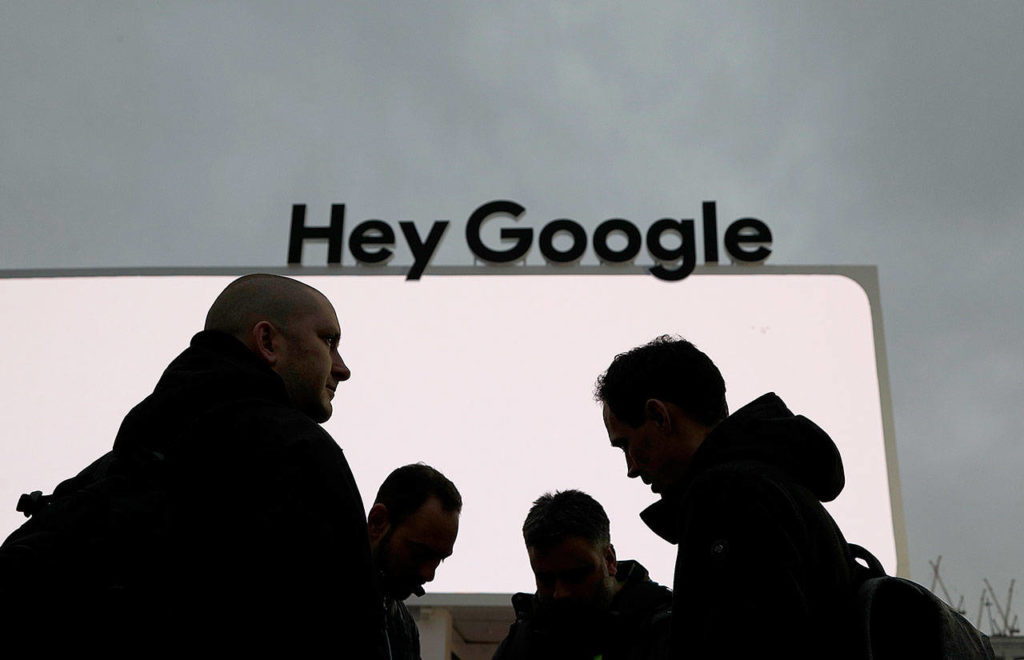 People stand in front of the Google tent Jan. 5, during preparations for CES International in Las Vegas. Google employees have had more success than other tech workers at demanding change at the company. Google dropped a contract with the Pentagon after employees pushed back on the ethical implications of using company technology to analyze drone video. (AP Photo/John Locher, File)
