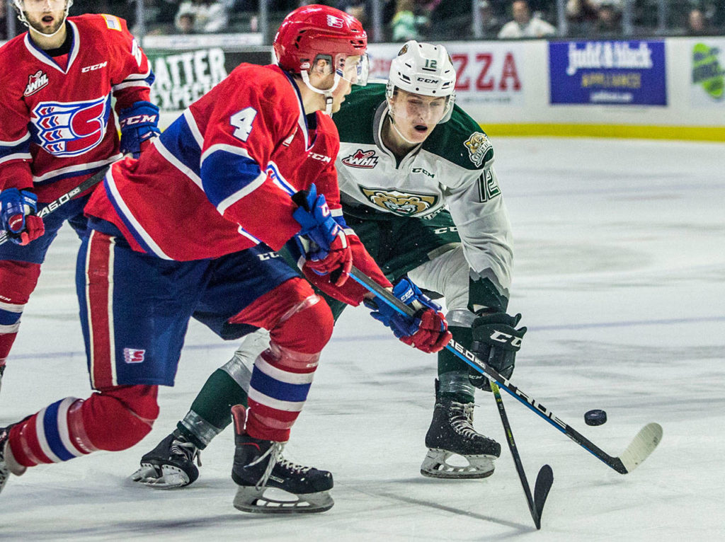 Silvertips’ Max Patterson fights for the puck during the game against the Spokane Chiefs on Sunday, April 7, 2019 in Everett, Wash. (Olivia Vanni / The Herald)

