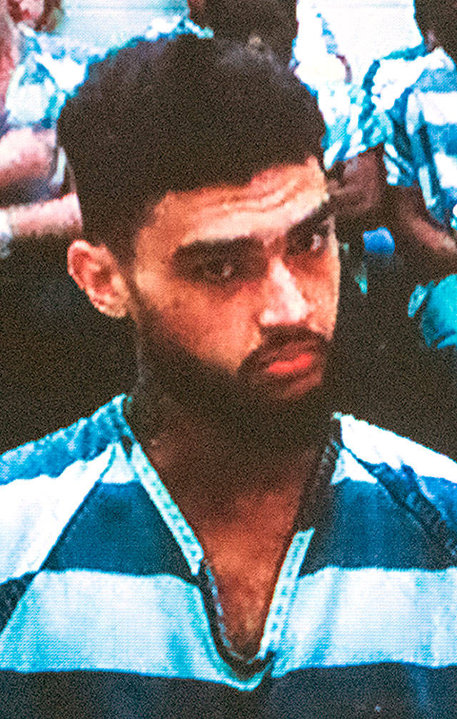 Jerradon Phelps, 20, of Tacoma, during a court appearance in Everett on Monday. He is accused of being an assailant in a 2017 murder-for-hire plot. (Caleb Hutton / The Herald)