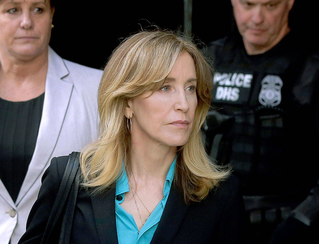 Actress Felicity Huffman arrives at federal court in Boston on April 3 to face charges in a nationwide college admissions bribery scandal. (AP Photo/Steven Senne, File)