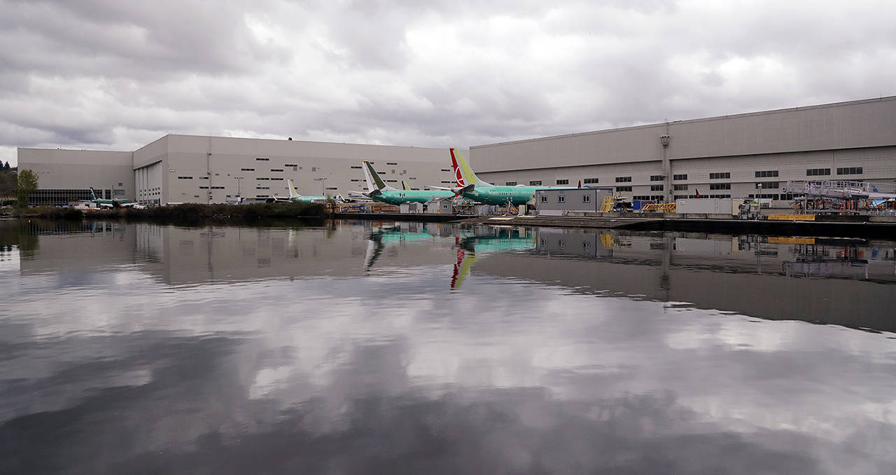 Boeing 737 MAX model jets are parked at the back of Boeing’s production facility adjacent to the south end of Lake Washington on Monday in Renton. (AP Photo/Elaine Thompson)